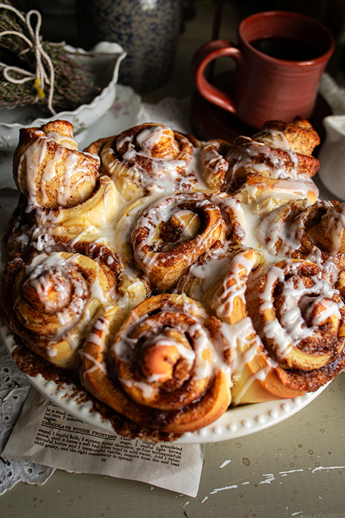 Freshly baked cinnamon rolls with white icing